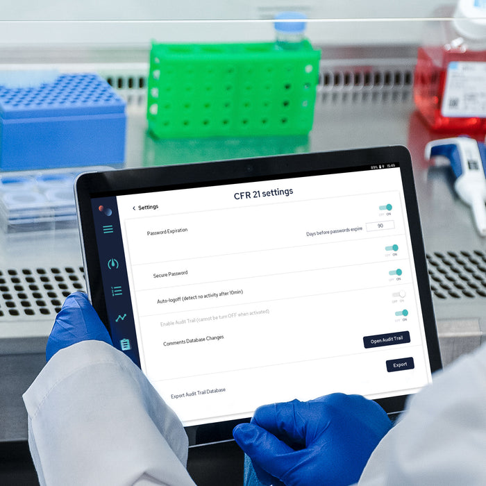 Scientist holding a tablet with the Soft Matter Analytics™ Compliance Add-On for FDA 21 CFR Part 11, ensuring regulatory adherence in laboratories.